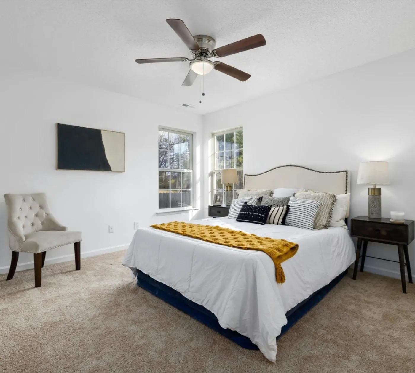 Staged bedroom with soft neutral carpet installed by New Orleans Flooring